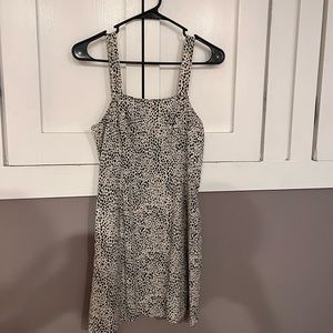 This is a “cheetah” print above the knee dress that fits true as a small